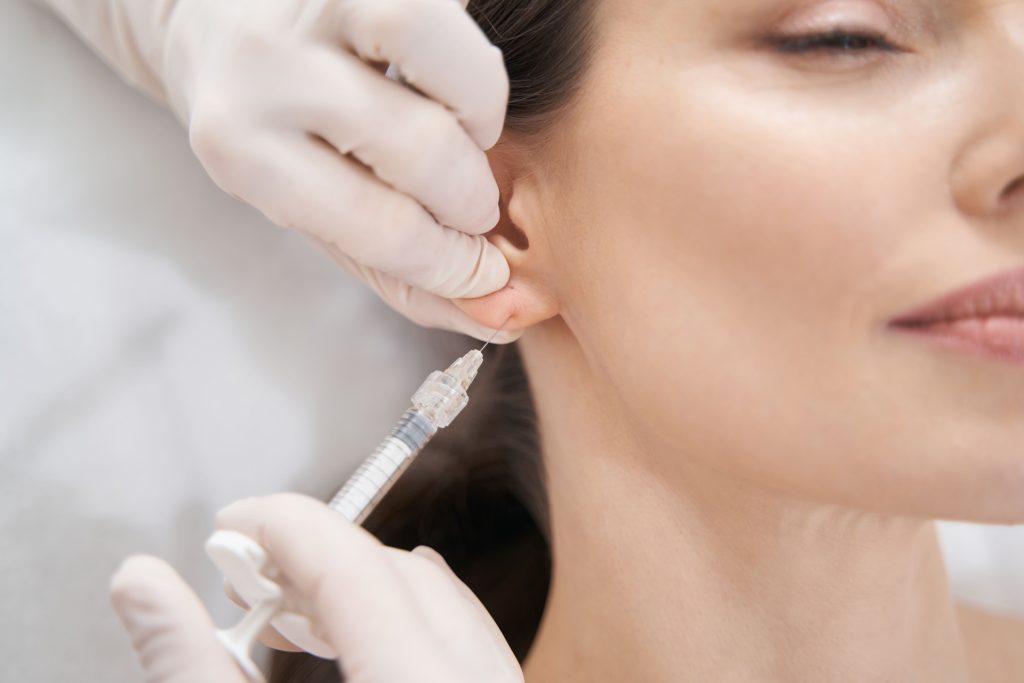 doctor-beautician-making-beauty-injection-in-femal-2023-11-27-05-07-51-utc