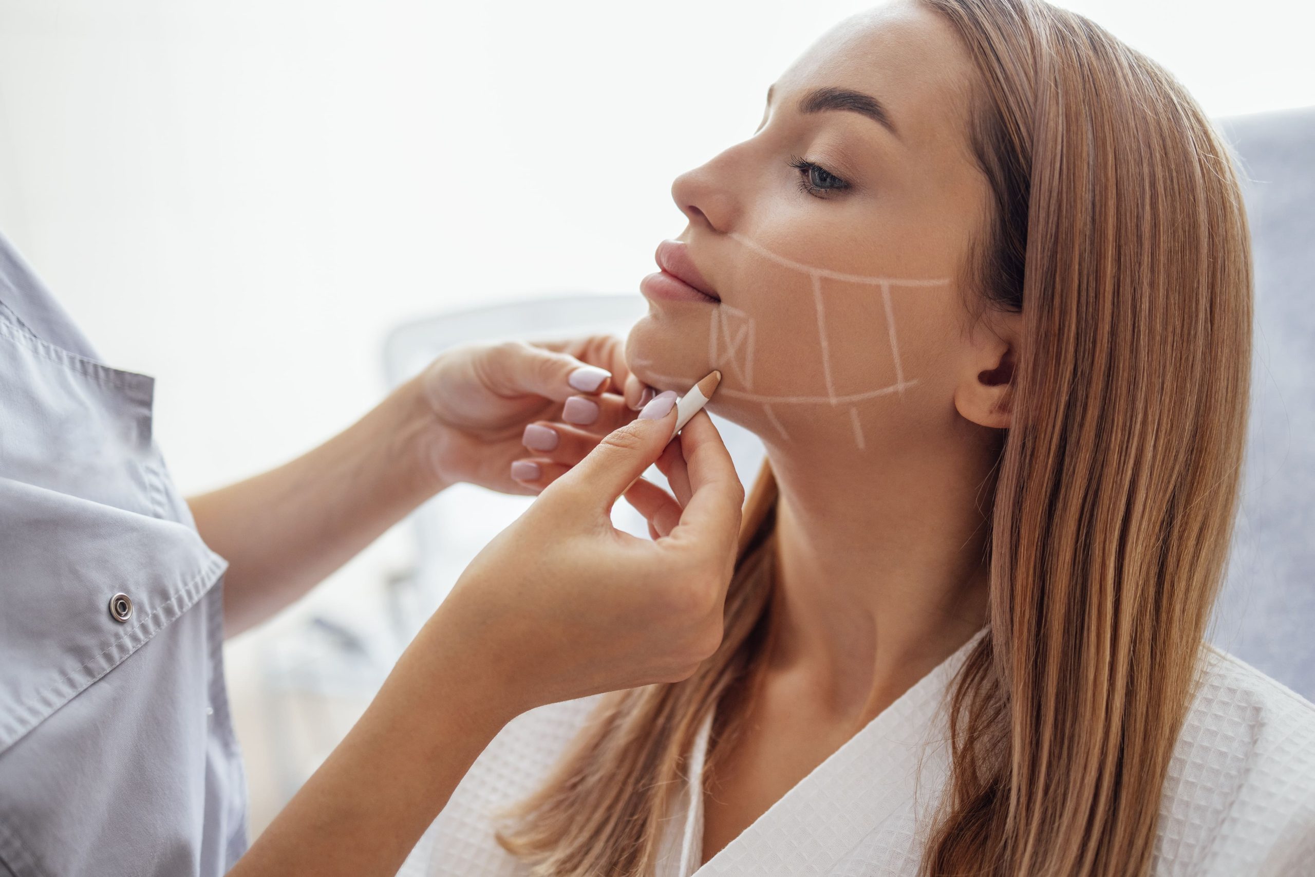 doctor-checking-woman-face-skin-in-cosmetology-cli-2023-11-27-04-53-09-utc