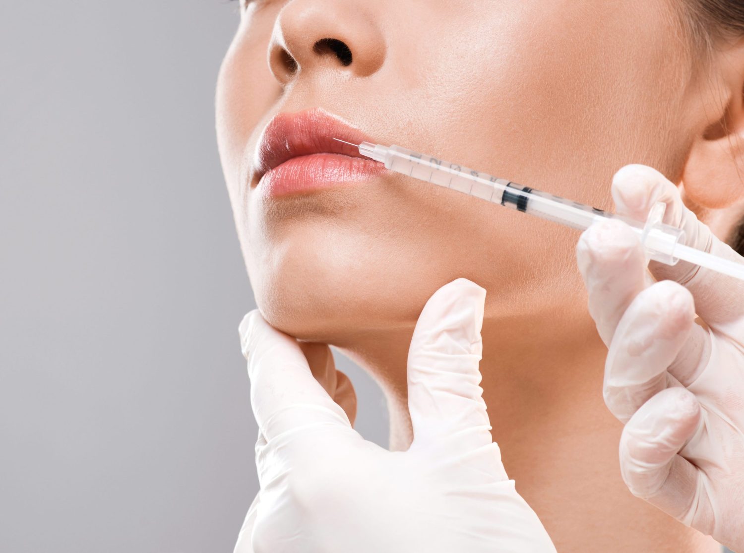 nurse-making-lip-injection-for-young-woman-2023-11-27-04-50-00-utc