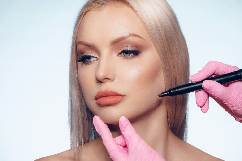 woman-face-and-doctor-hands-with-pencil-plastic-s-2023-11-27-05-13-24-utc
