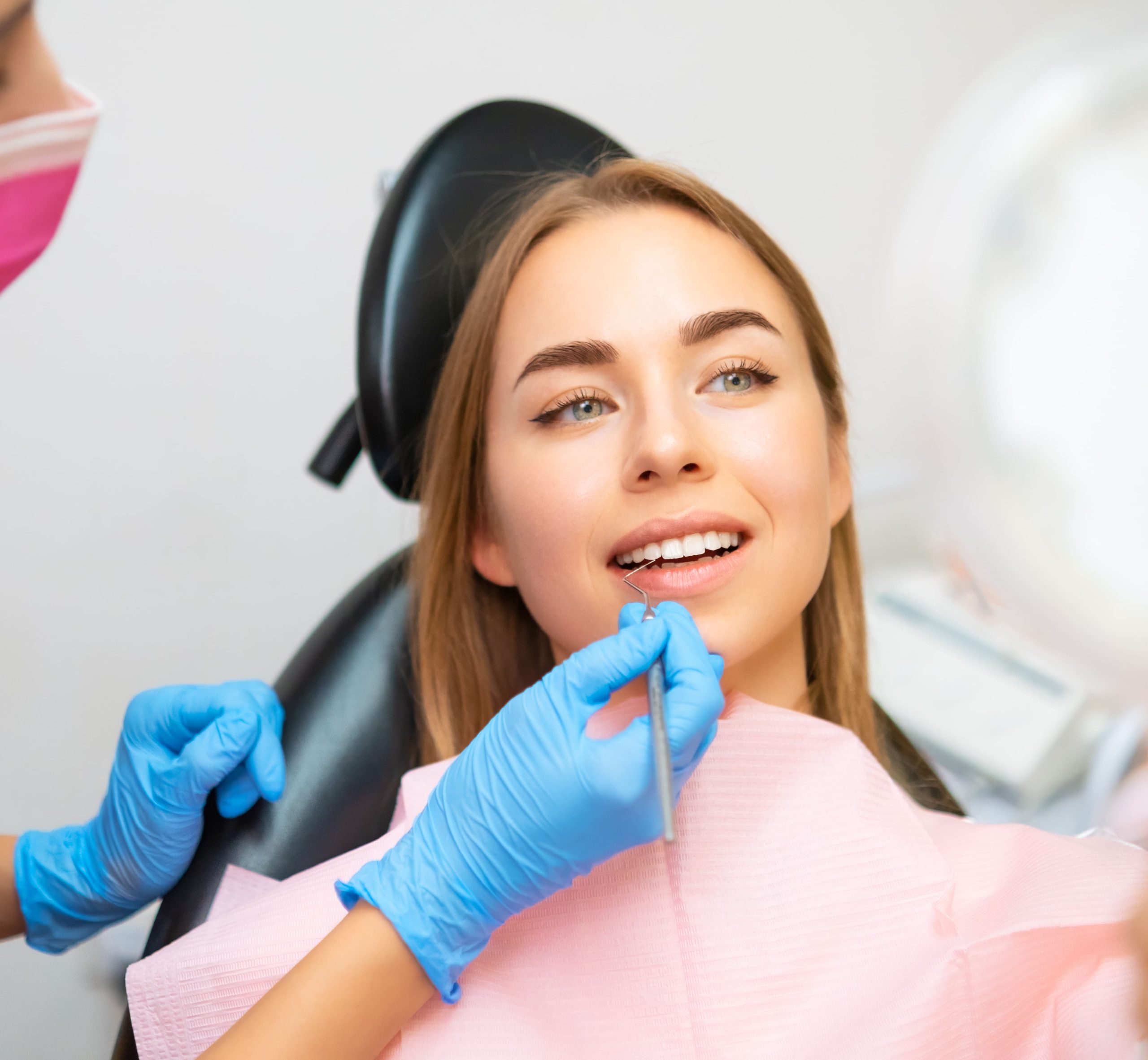 woman-looking-to-mirror-after-teeth-treatment-in-m-2023-12-08-21-12-13-utc (1)